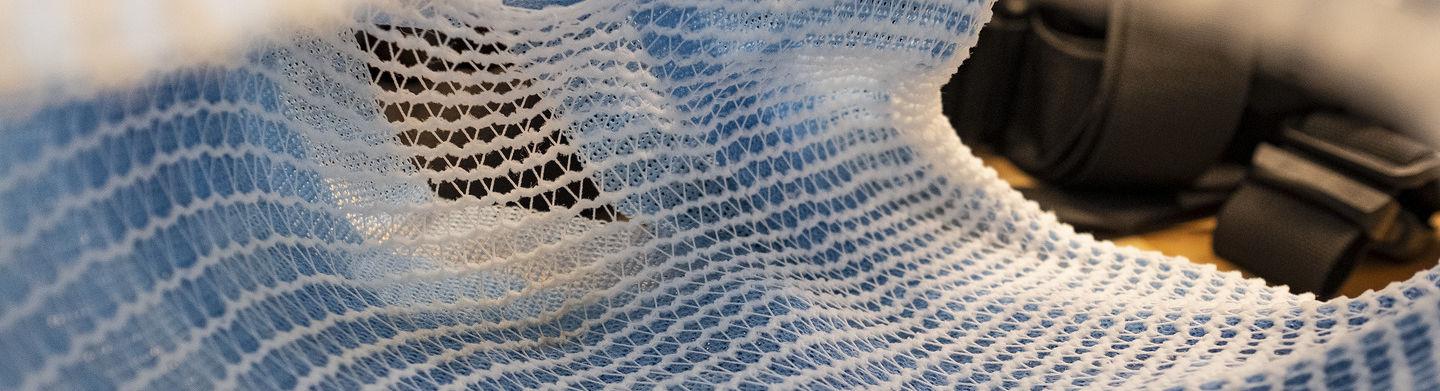 A white plastic netting material used in the development of animal prosthetics.