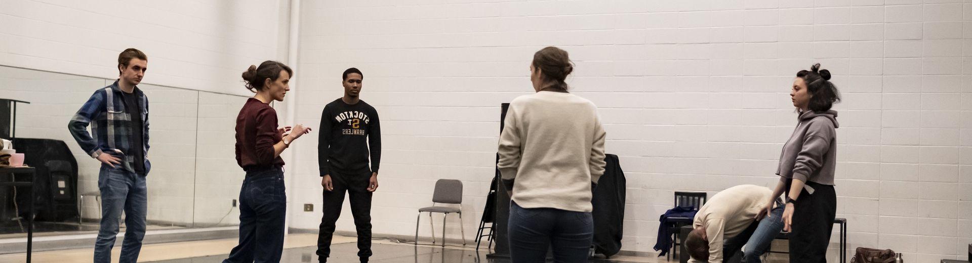A group of students discuss a scene from the play, "Somewhere."