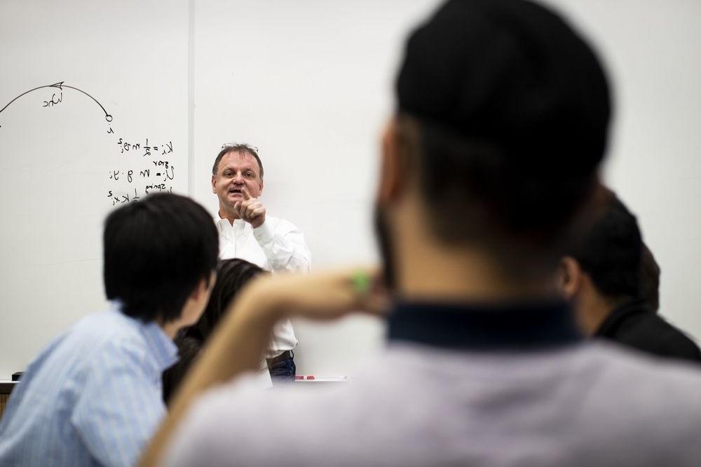 Physics professor lecturing to an undergraduate class