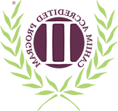 A green and purple logo for the Commission on Accreditation for Health Informatics and Information Management Education.